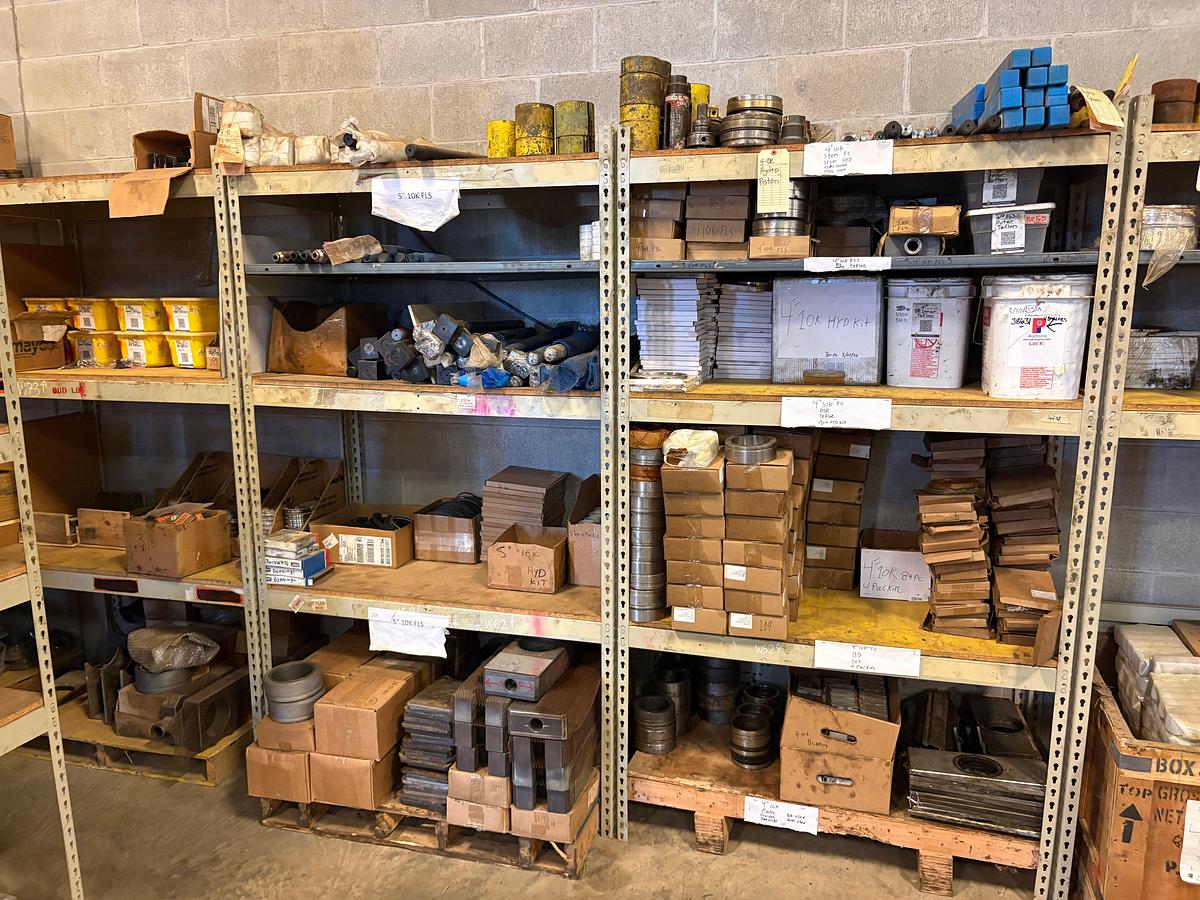 Used (4) sets of shelving w/ assorted frac valve/gate valve parts