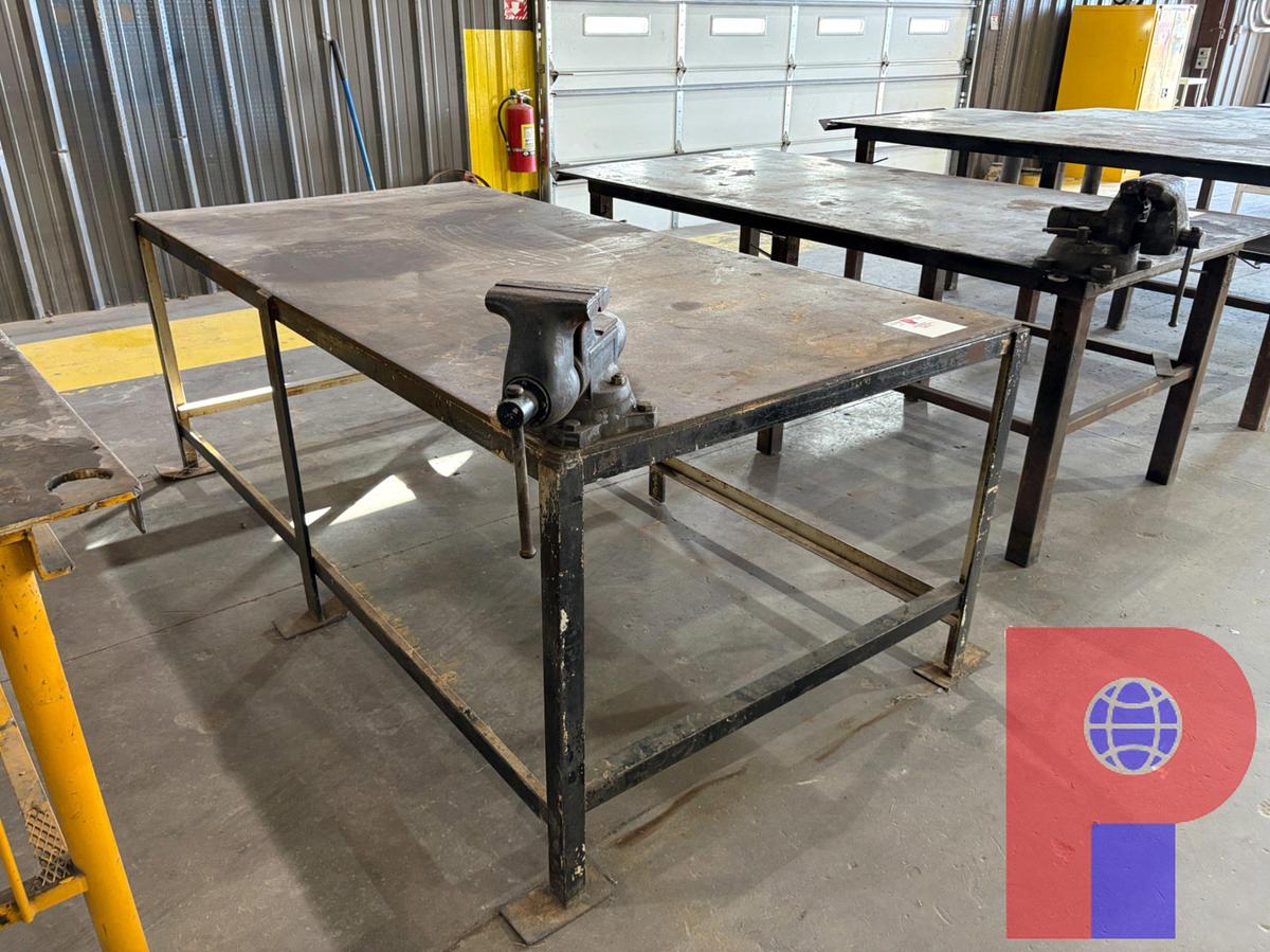 Used 8’ X 4’ X 3’ STEEL SHOP TABLE W/ BENCH VISE