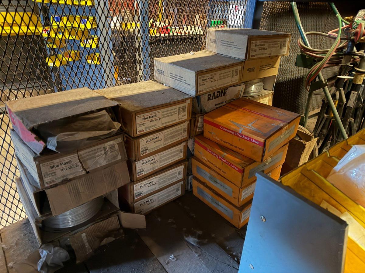 Used (3) Shelves W/ 30+ boxes of Lincoln Welding wire, New Gun Tips & Nozzles, & supplies