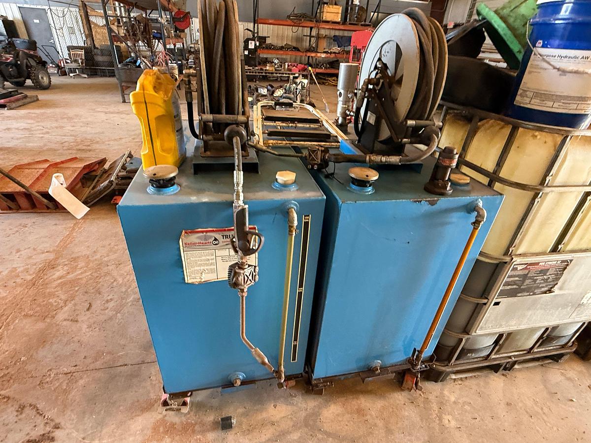 Used LOT W/ (2) 150-GALLON STEEL ROLLING OIL TANKS W/ AIR PUMPS, GUNS, & HOSES, (HAS SOME FLUID), (3) ROLLING LUBE BBLS, & RELATED