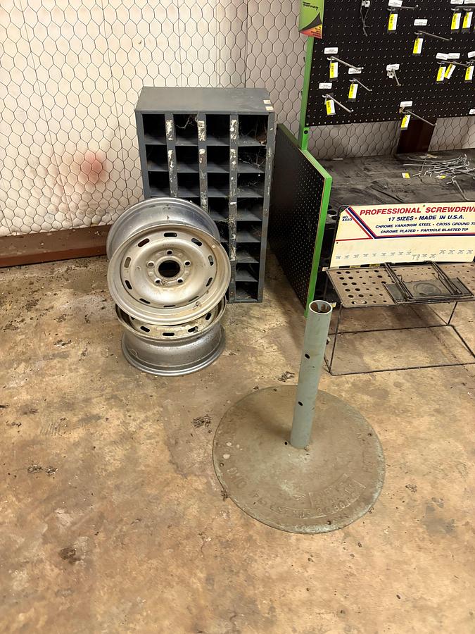 Used Display peg board, bolt bin, & (2) 5-lug wheels