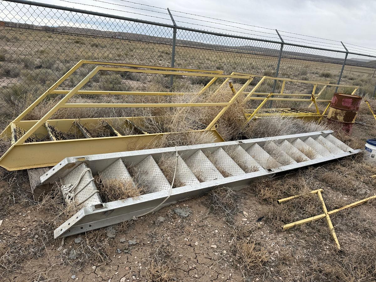 Used (1) 12' EXTENDABLE ALUMINUM, (1) 15' ALUMINUM, & (2) 15' STEEL W/ HAND RAILS RIG LADDERS