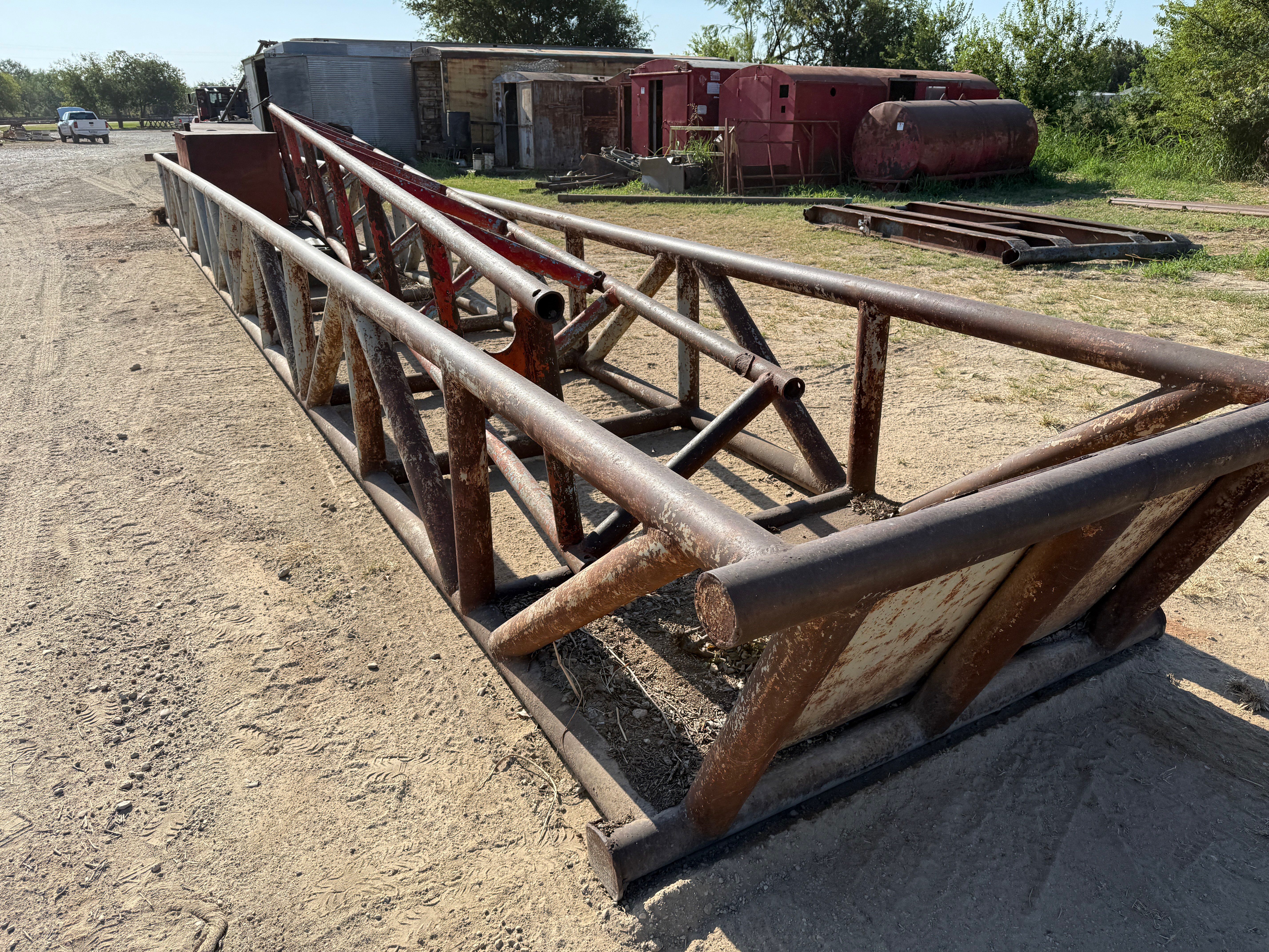 Used 50’ x 5’ x 3’ SKIDDED PIPE TUB W/ CONTENTS