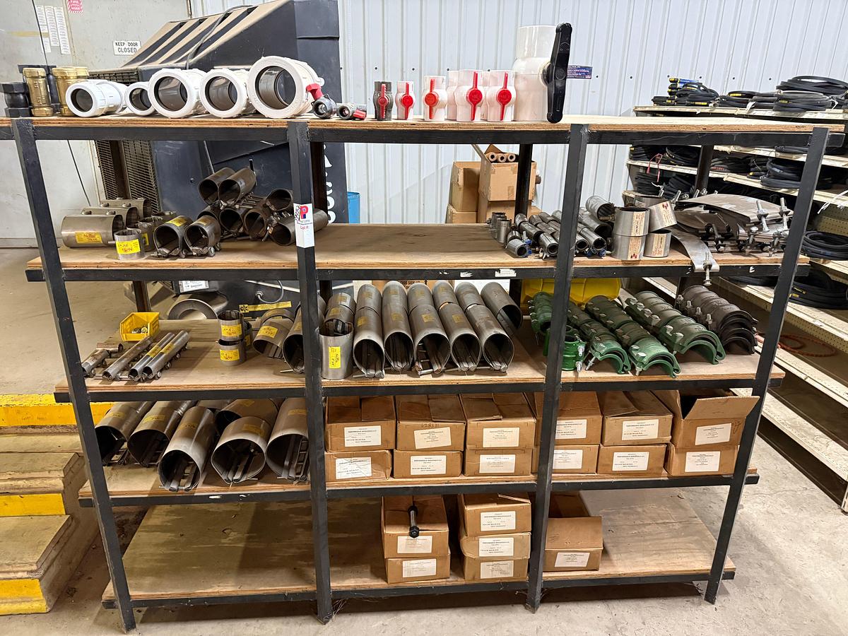 Used 5-SHELF RACK W/ CONTENTS OF PVC BALL VALVES & UNIONS, NETCO COLLAR LEAK REPAIR CLAMPS, (14+) BOXES 5/8” THRU 1” STUDS & NUTS