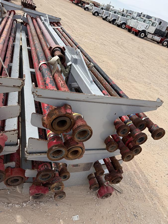 Used (22 X $) (17) 2” X 15’L & (5) 3” X 15’L FIG 1502 15K WP FLOW IRON W/ (2) 2-TIER STACKABLE PIPE RACKS