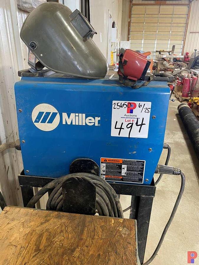 Used MILLER XMT304 CC DC INVERTER ARC WELDER W/ ROD BOX, RODS & WIRE