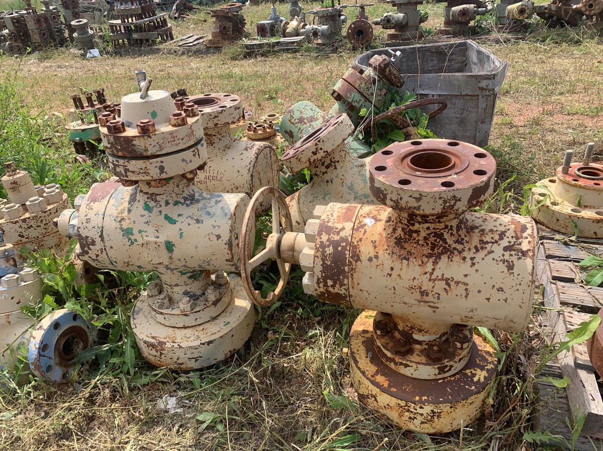 Used Row of 2in Flange Adapters, Caps, DSA’s, 4-1/16 Plug Valves, 7-1/16 Casing Heads and 2in Fluid Crosses