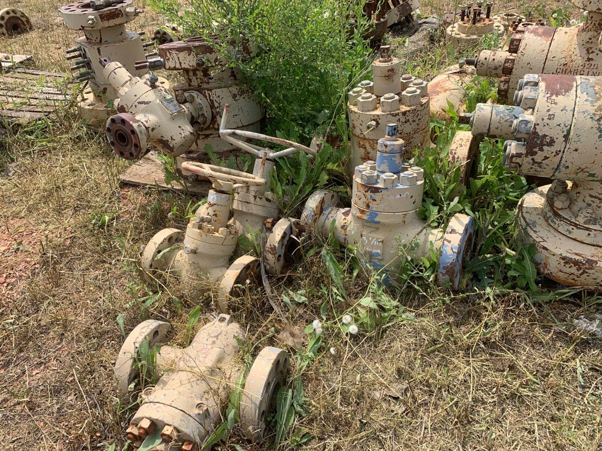 Used Row of 2in Flange Adapters, Caps, DSA’s, 4-1/16 Plug Valves, 7-1/16 Casing Heads and 2in Fluid Crosses