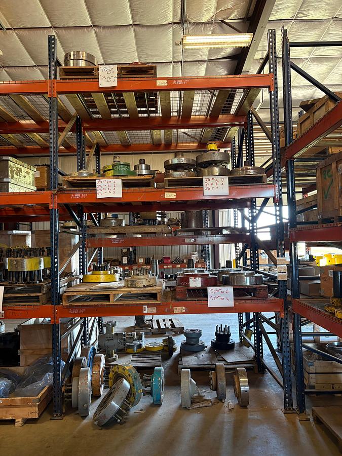 Used contents of (4 shelves) w/ (35+) assorted landing flanges, single stud adapters, & adapter flanges