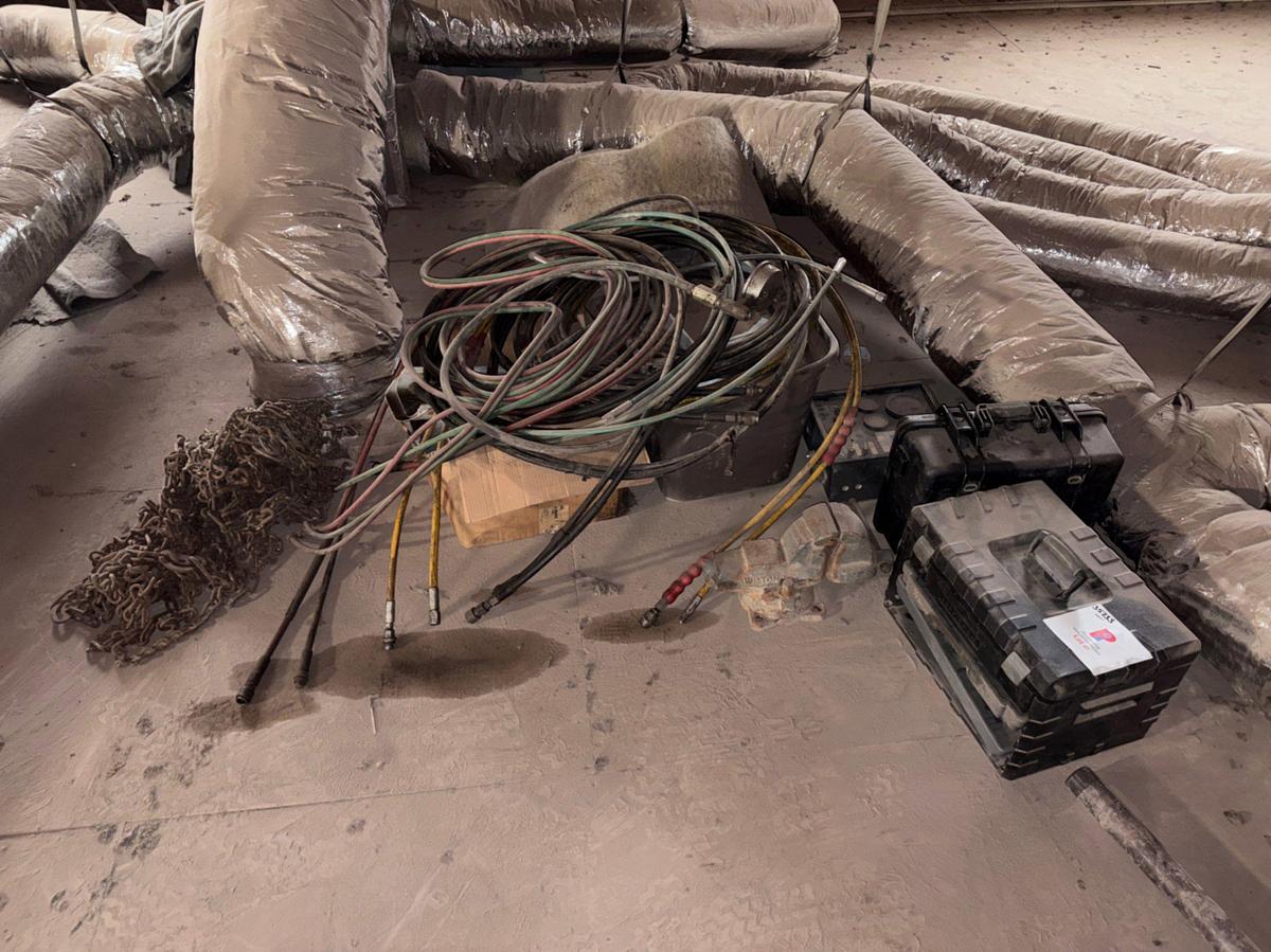 Used Lot of assorted welding gas & hydraulic hoses, tire chains, bench vise, etc