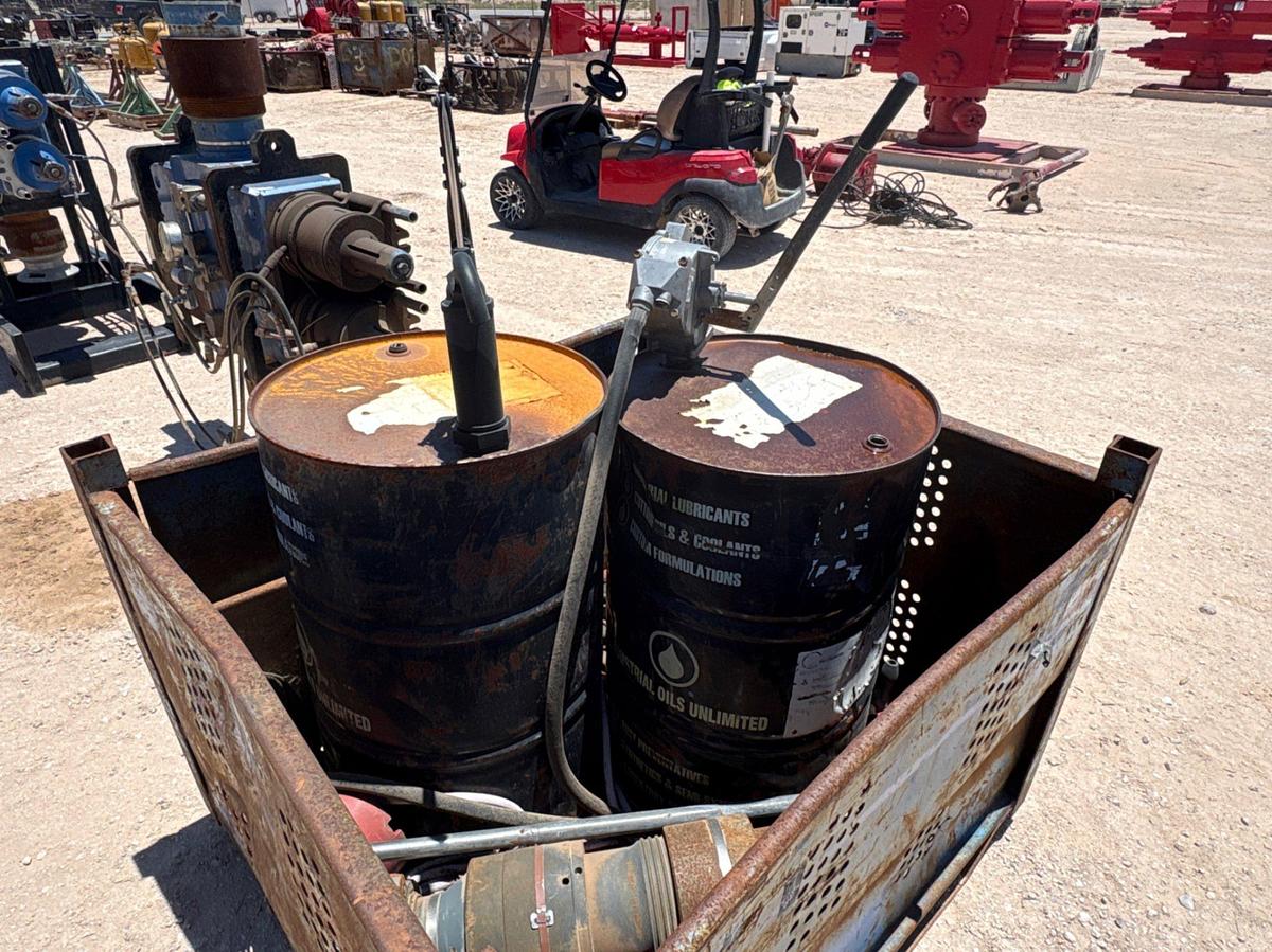 Used 4.5’ x 4’ x 3’ bin w/ (2) lubricant drums w/ manual grease pumps