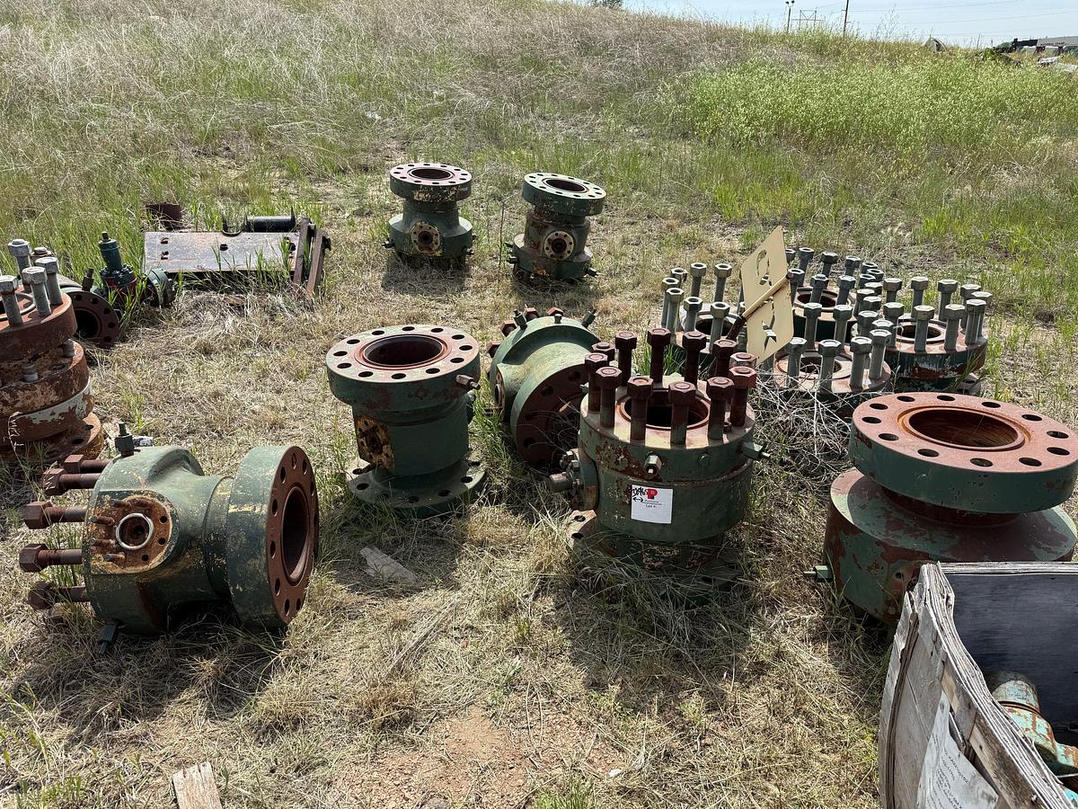 Used ROW / SECTION OF (7) MOSTLY 11” x 2-1/16” 10M CASING HEADS, GATE VALVES, CROSSES, TEES, ADAPTER SPOOLS & REL