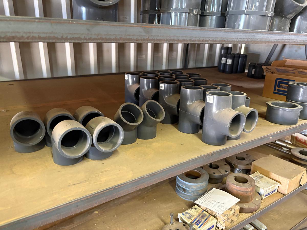 Used Contents of (5) shelves w/ U-line oil spill pads, various 2” to 4” PVC pipe fittings, etc.