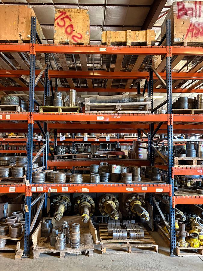 Used Contents of (4 shelves) w/ (50+) flat top & wrap around style tubing/casing hangers