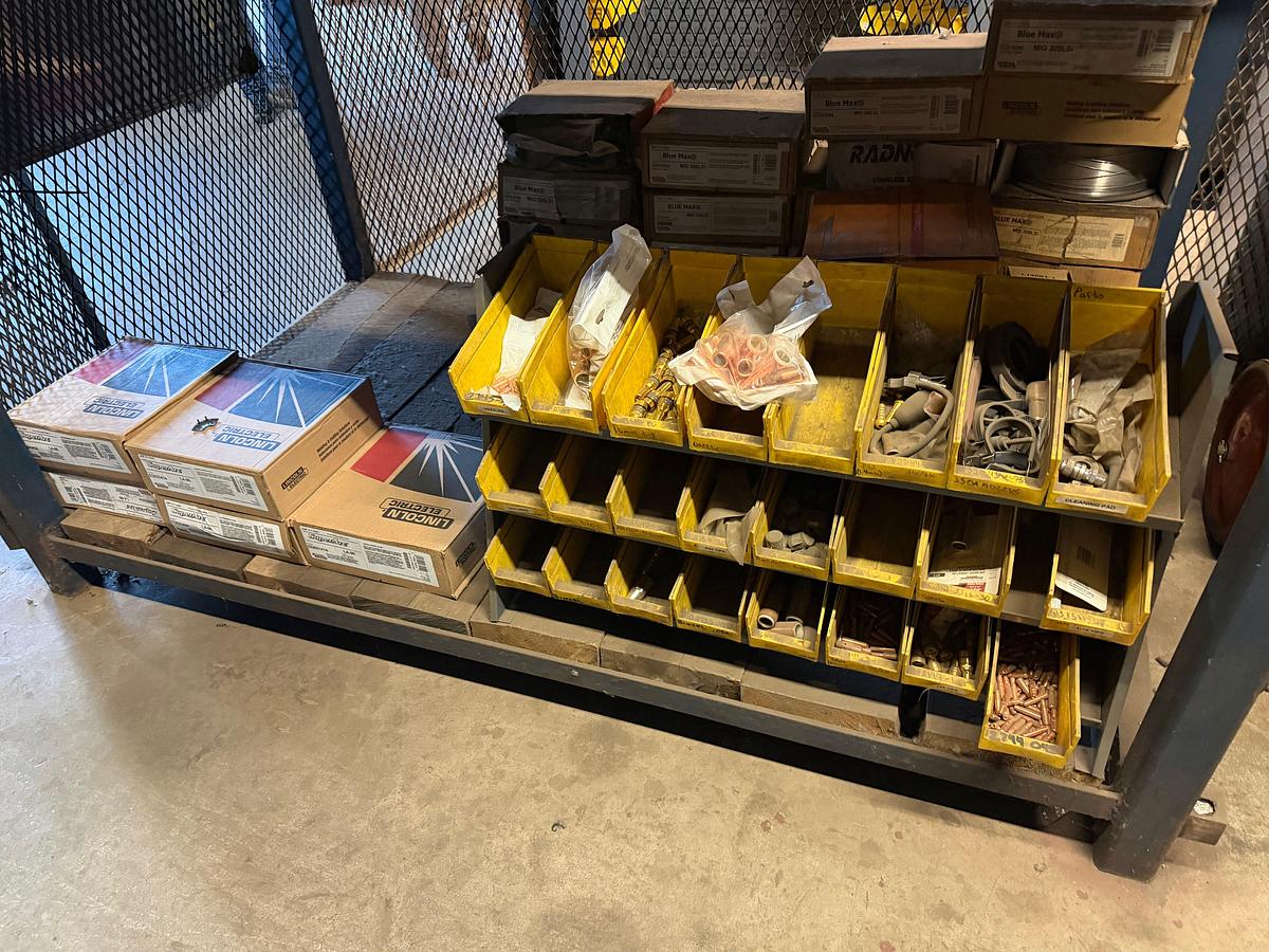 Used (3) Shelves W/ 30+ boxes of Lincoln Welding wire, New Gun Tips & Nozzles, & supplies