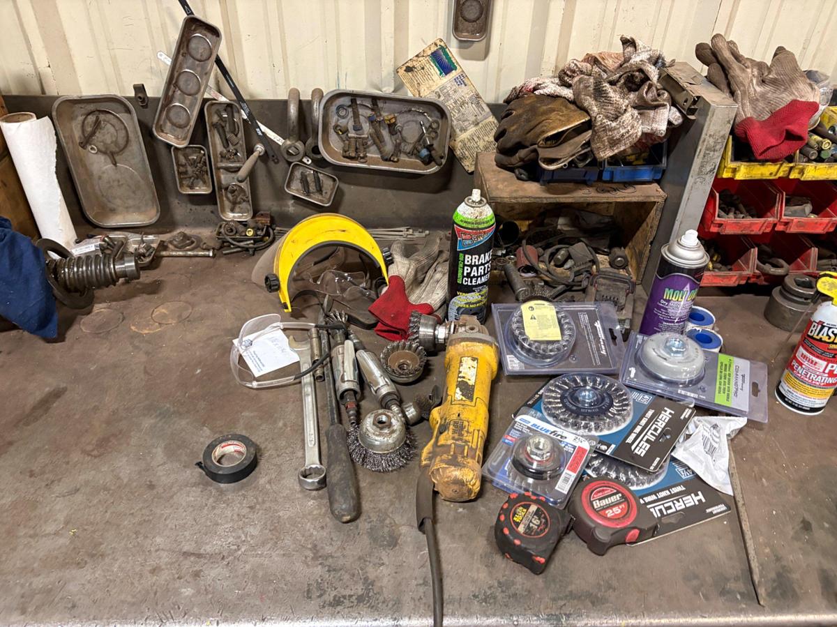 Used 10’ x 3’ x 3’ metal shop table w/ contents