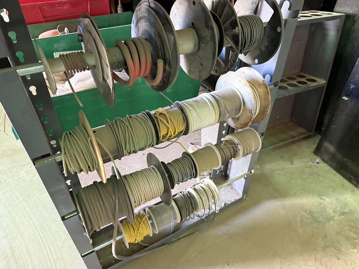 Used 96”L X 24”W X 72”H 3-SHELF RACK, (1) 24-COMP. FITTING BIN, & (1) 4-ROW ELECTRIC WIRE REEL RACK, ALL W/ TRUCK PART & RELATED