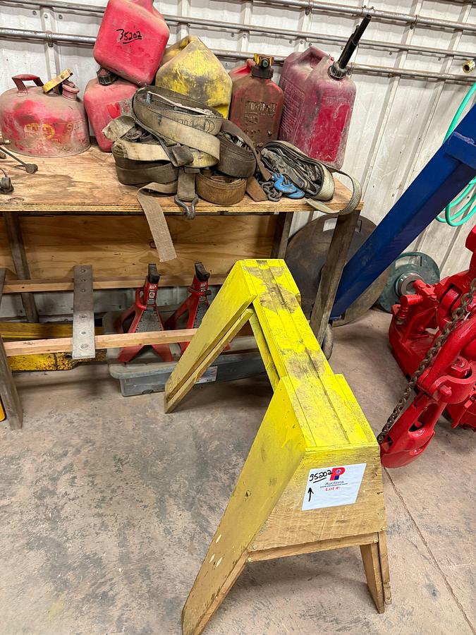 Used (2) 6 TON & (1) 3 TON JACK STANDS, (2) WOODEN SAW HORES, (6) 2” RATCHET STRAPS, (6) GAS CANS