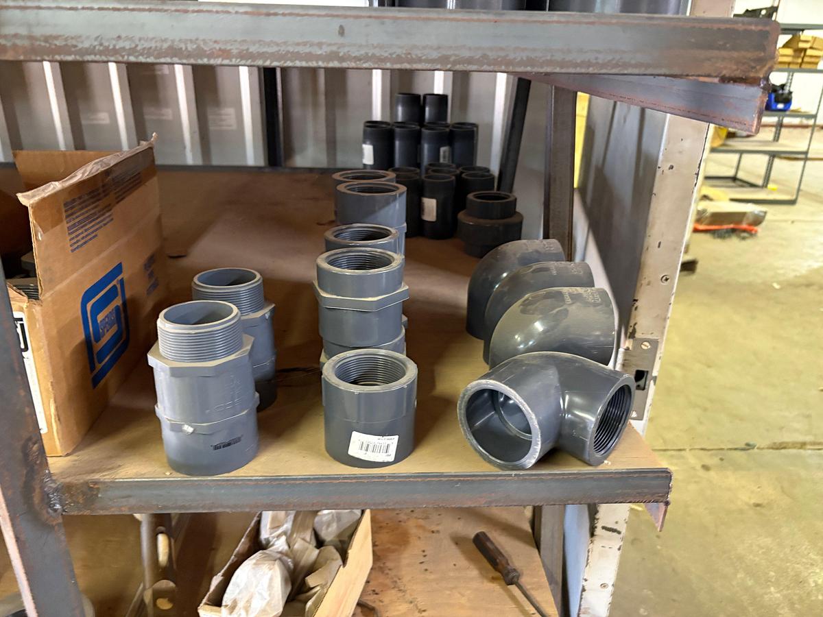 Used Contents of (5) shelves w/ U-line oil spill pads, various 2” to 4” PVC pipe fittings, etc.