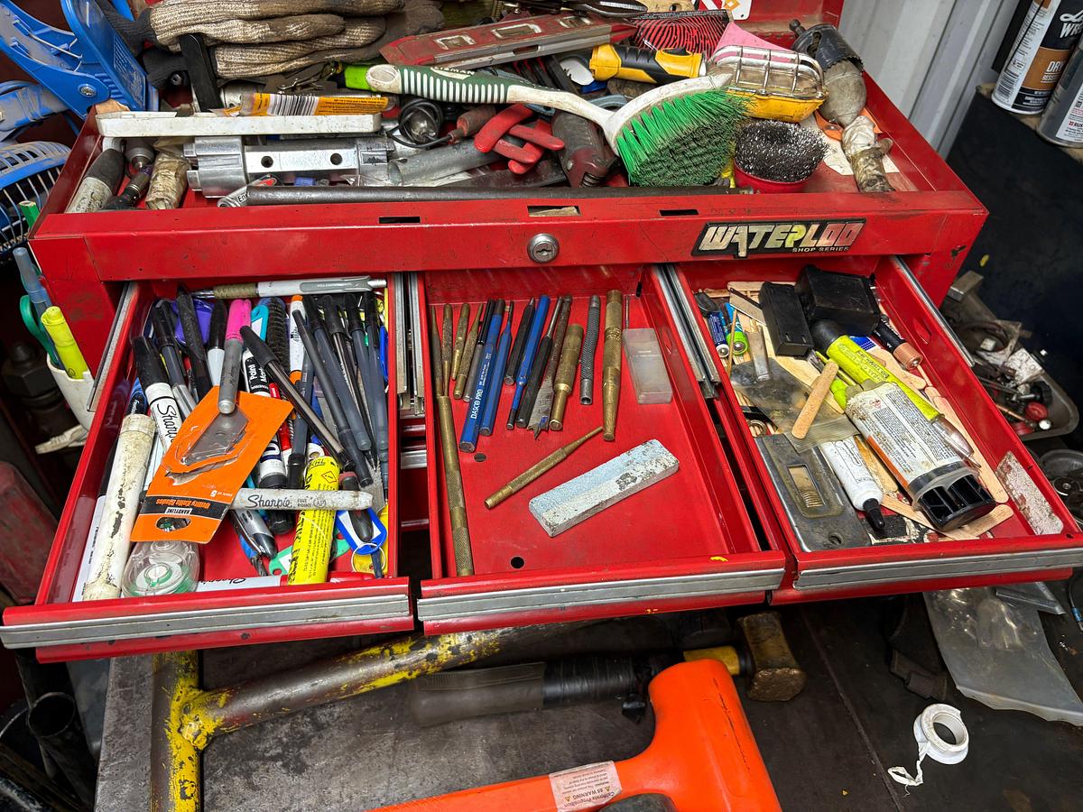 Used 64” x 40” x 41” metal shop table w/ contents