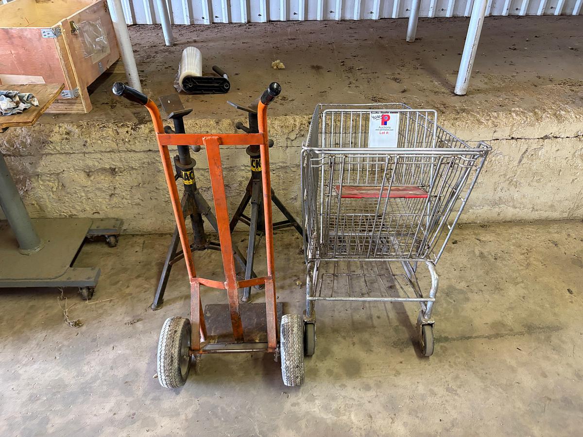 Used (2) adjustable height pipe stands, (1) 2-wheel dolly, & (1) shopping cart