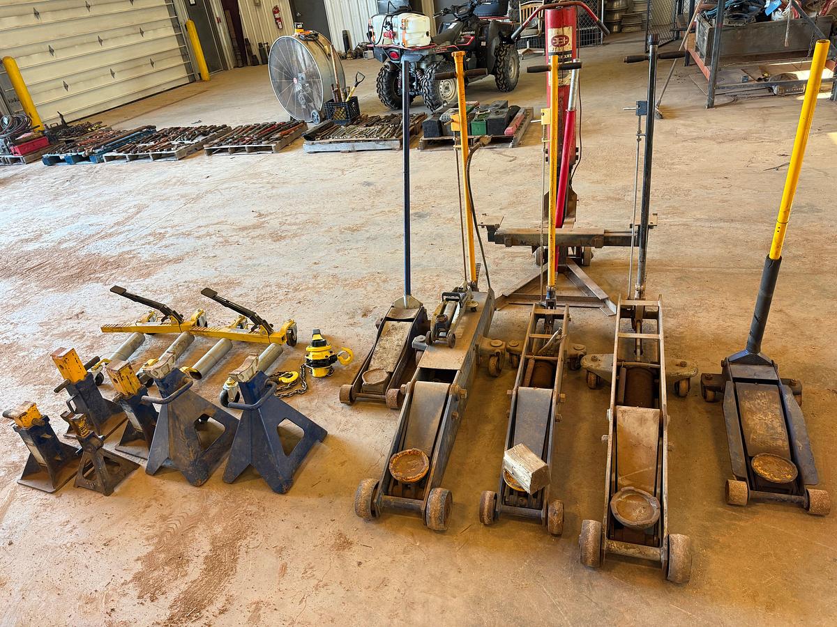 Used LOT OF (7) 2-TON TO 20-TON FLOOR JACKS, (1) 1-1/2 TON CHAIN HOIST, (2) DAYTONA WHEEL DOLLEYS, (6) 10-TON TO 22-TON JACK STANDS