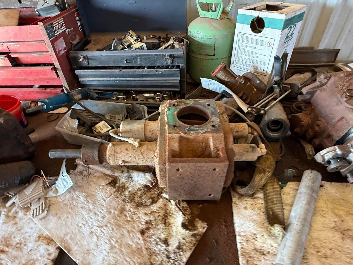 Used 8’ x 4’ x 3’ HD STEEL SHOP TABLE W/ CONTENTS OF (2) TOOLBOXES, PTO, HYD PUMP PARTS, BOWIE PUMP, ROLLING OIL CATCH PAN