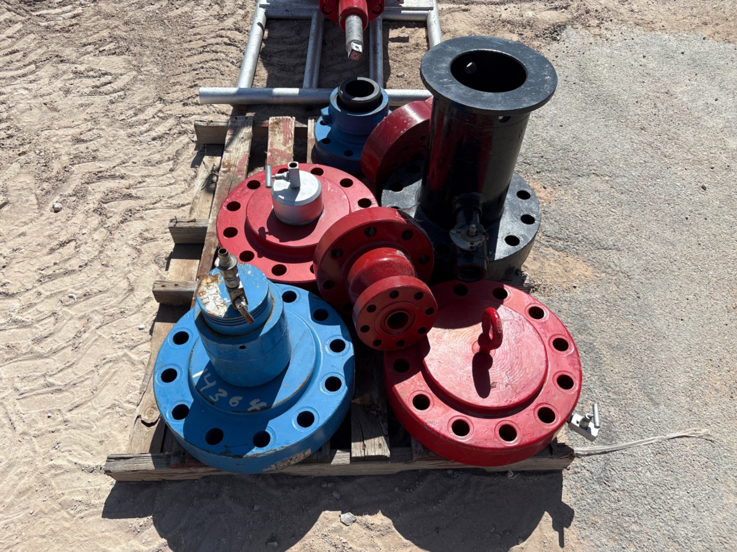 Used Pallet w/ wellhead flange,(2) 4” weco flanges, assorted test flanges