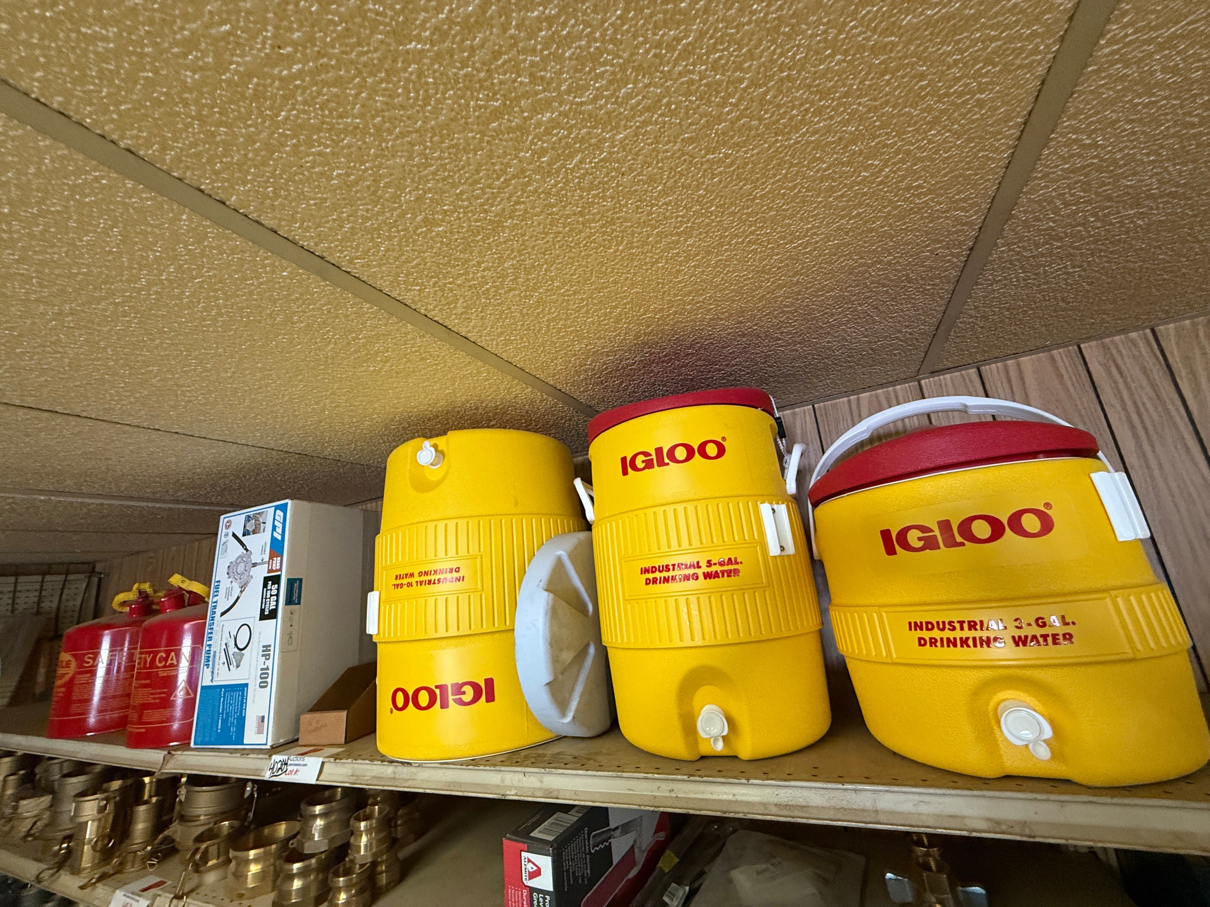 Used TOP SHELF W/ (3) 10-GAL IGLOO DRINKING COOLERS, (1) GPI ALUM HP-100 HAND PUMP, (2)EAGEL 5-GAL. SAFETY CANs
