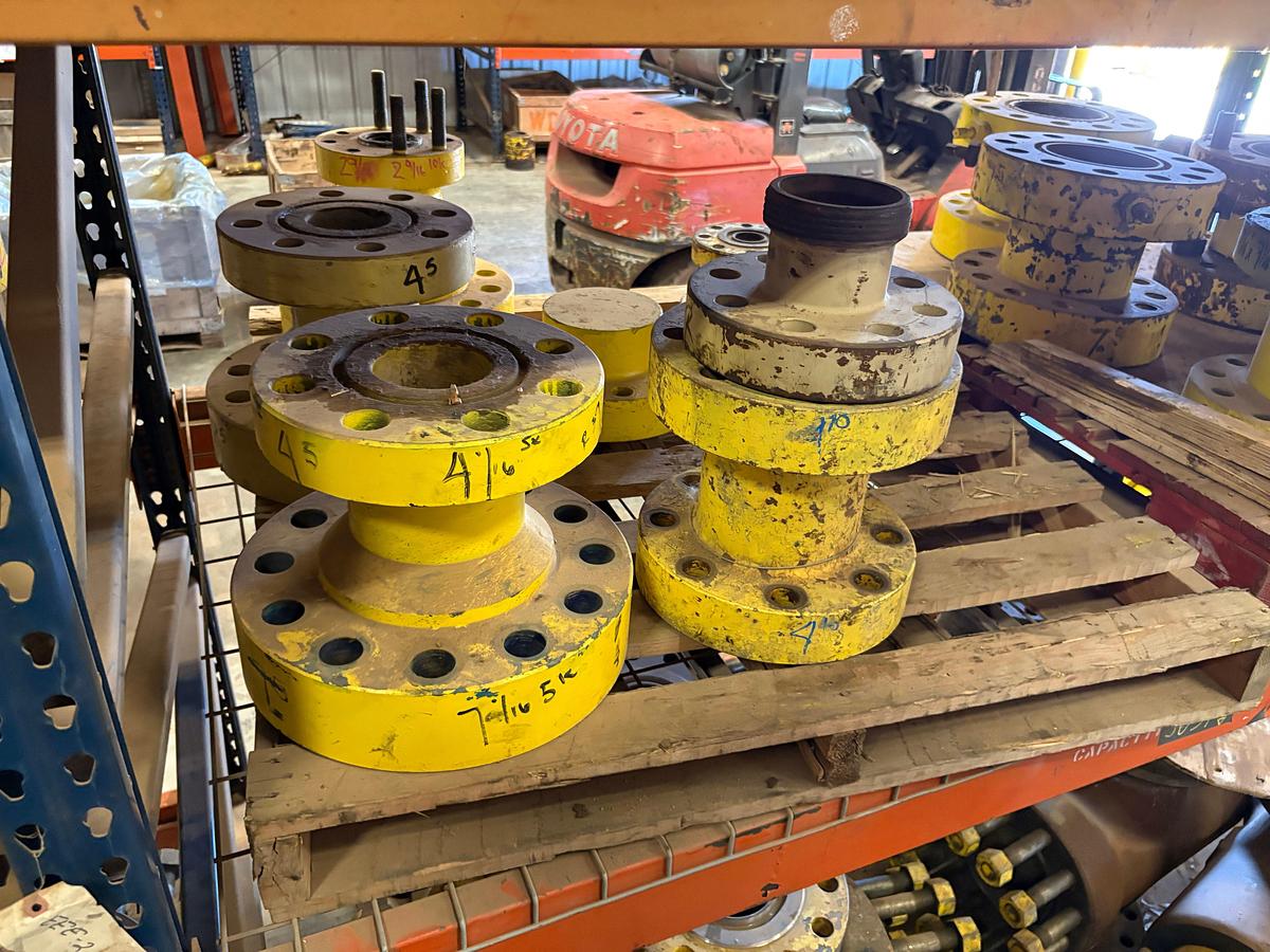 Used (4 shelves) w/ assorted 4” to 7” spools, single stud adapters, & 5” 10k blind flanges