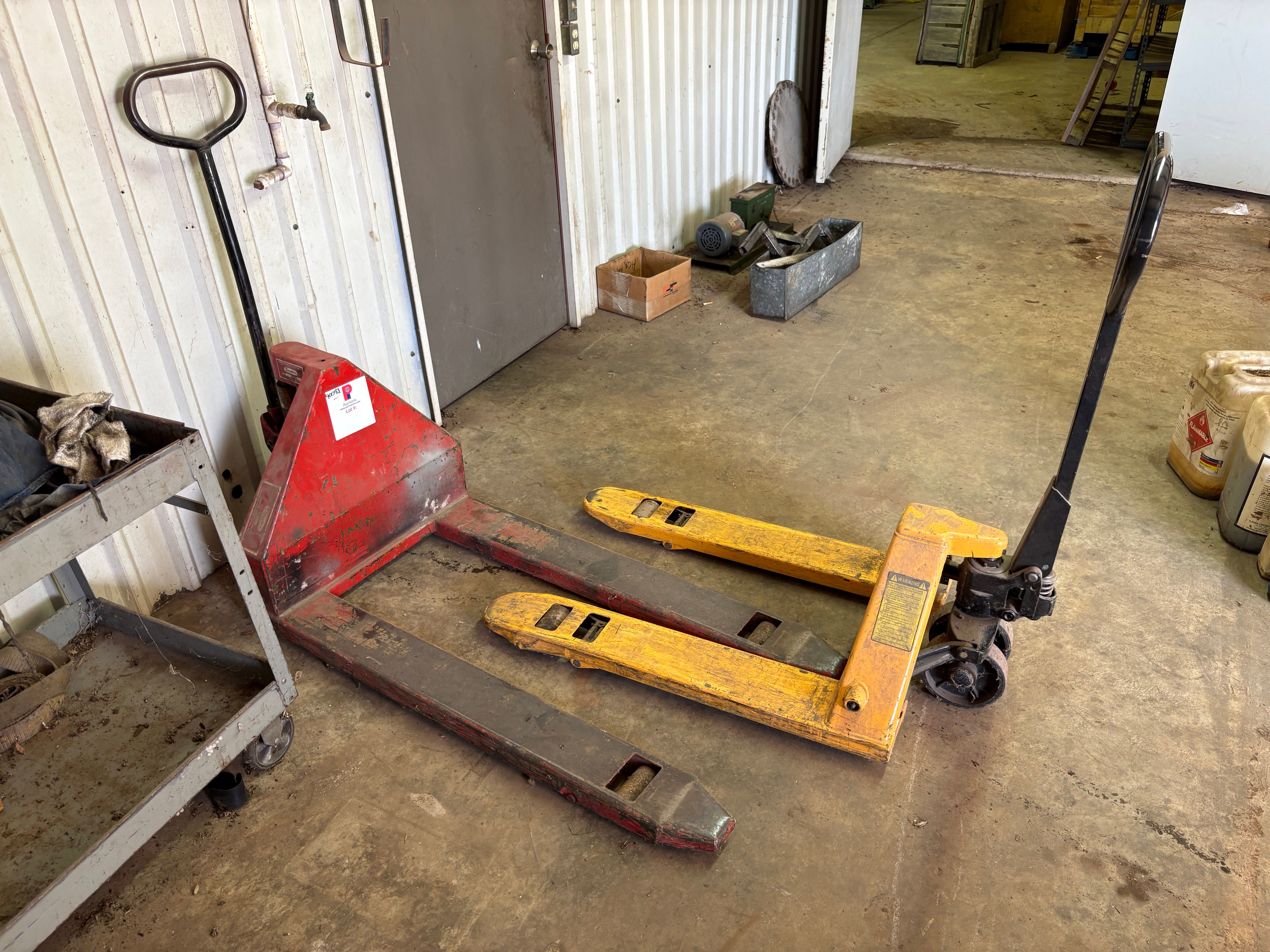 Used (2) pallet jacks & (1) rolling tool cart