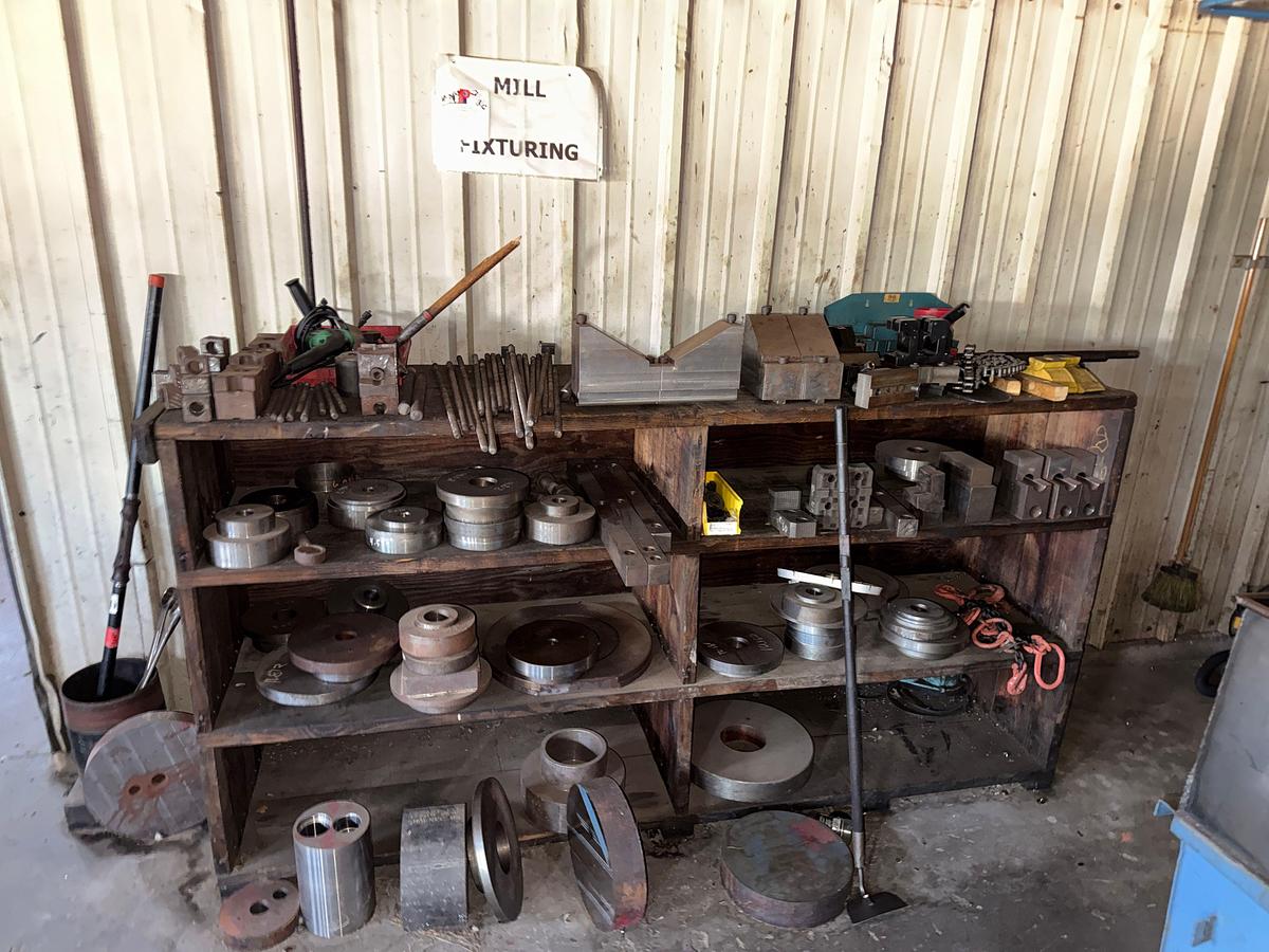 Used WALL W/ 3-ROW WOOD SHELF & CONTENTS OF MILLING MACHINE FIXTURES, ADAPTERS, & RELATED