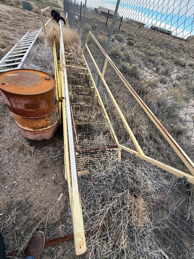 Used (1) 12' EXTENDABLE ALUMINUM, (1) 15' ALUMINUM, & (2) 15' STEEL W/ HAND RAILS RIG LADDERS