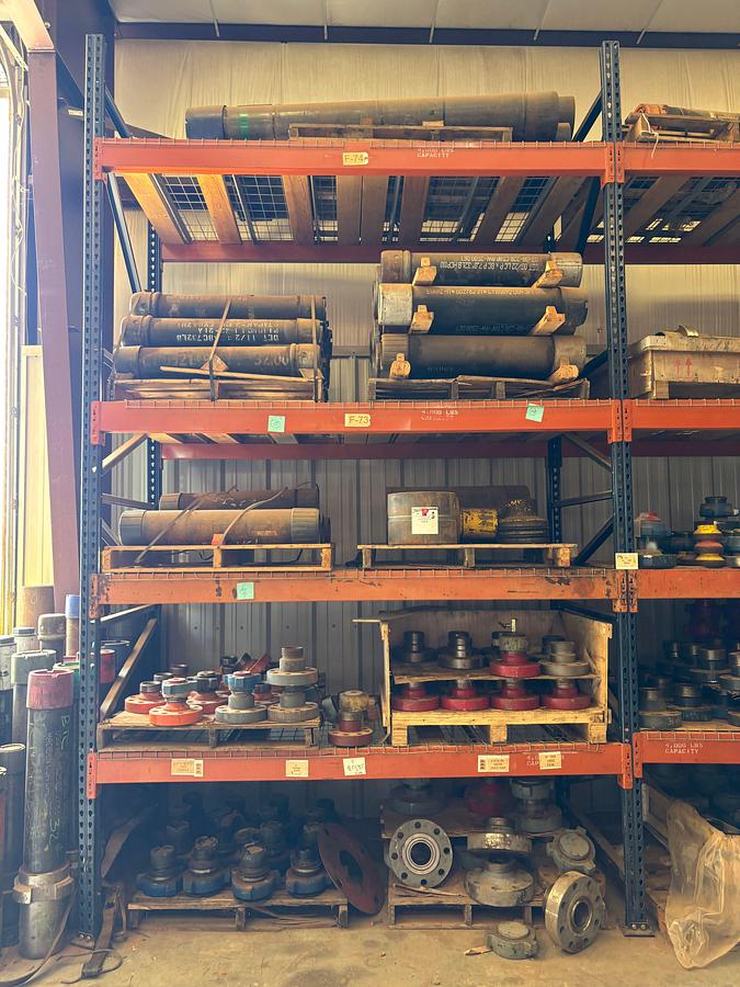 Used Contents of (4 shelves) w/ (65) assorted 2” to 4” weco flanges, casing hangers, & (38) 7” casing pup jts
