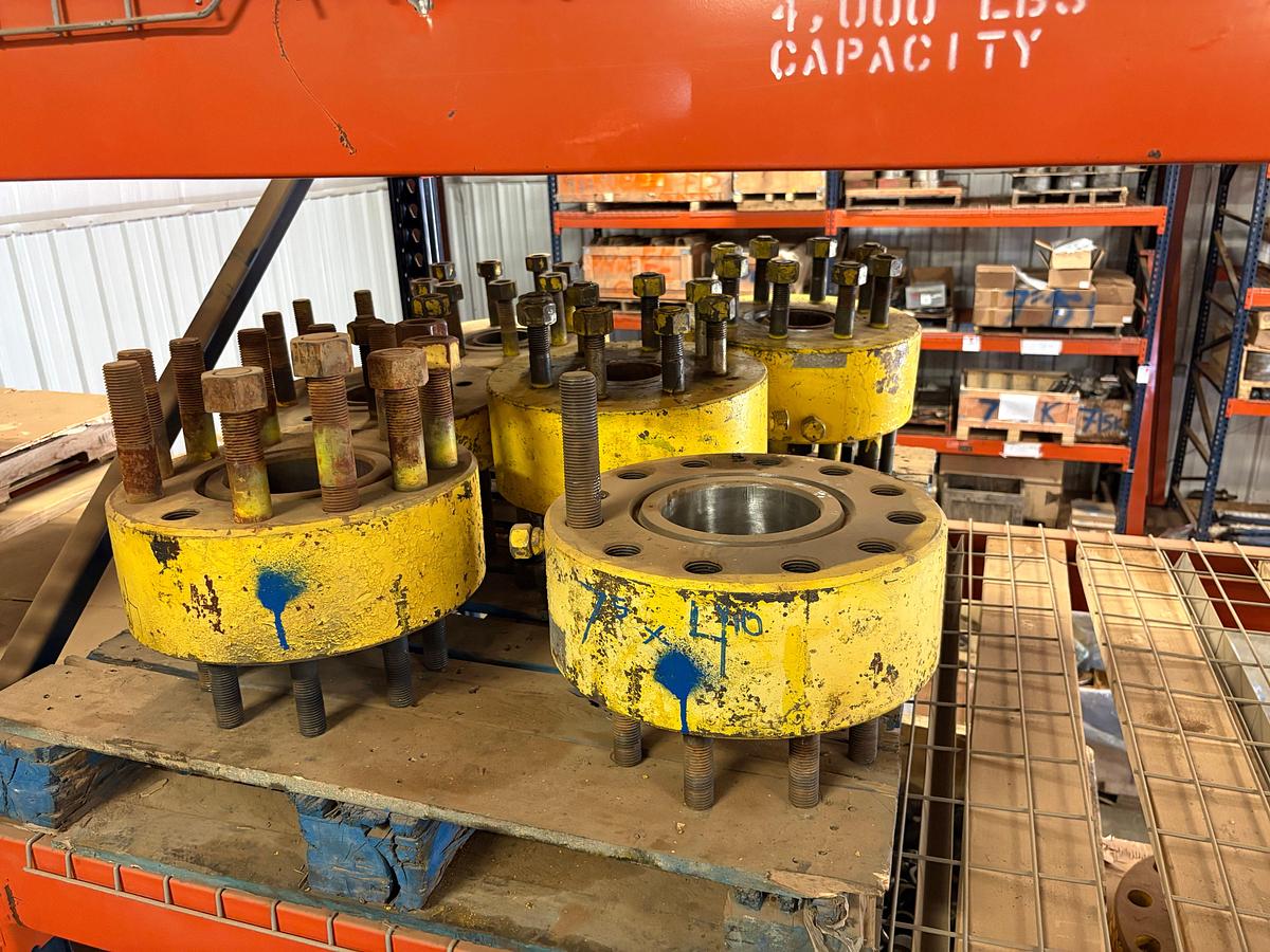 Used (4 shelves) of assorted single stud adapters, 4” to 7” spools, hydraulic valve actuators, etc
