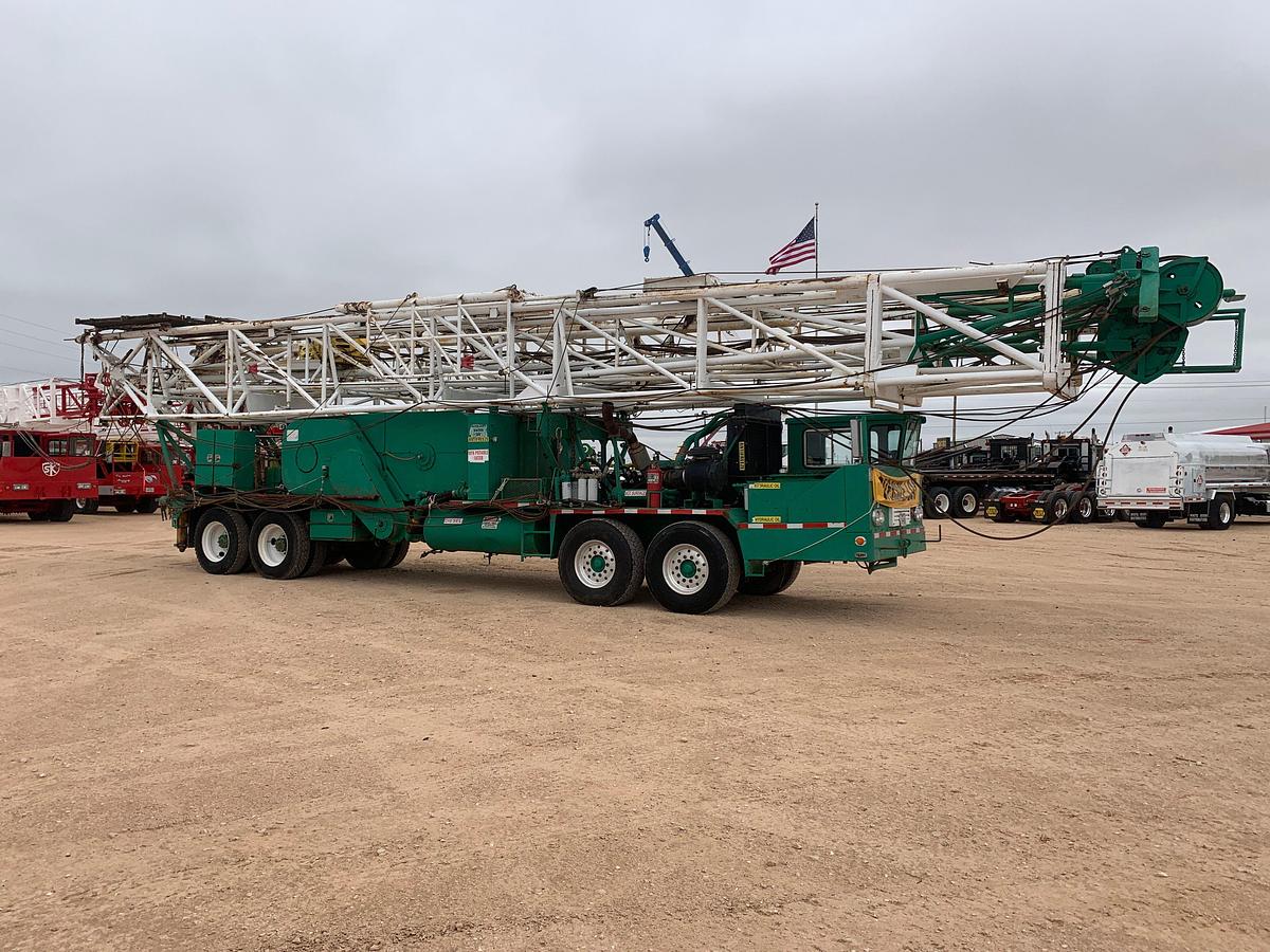 Used FRANKS 4-AXLE DOUBLE DRUM DRWKS WELL SERVICE RIG (96'x215K MAST)