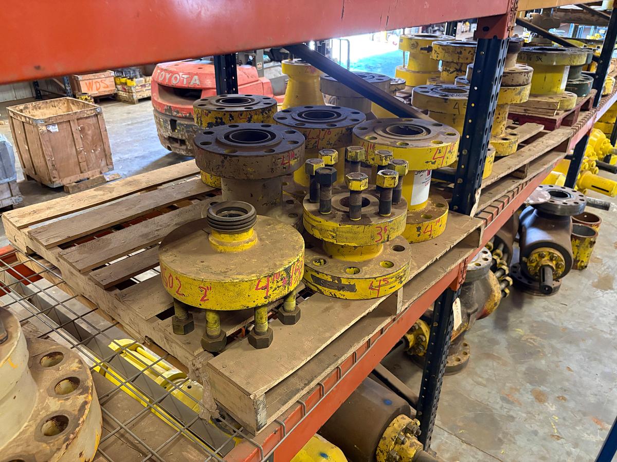 Used (4 shelves) of assorted single stud adapters, 4” to 7” spools, hydraulic valve actuators, etc