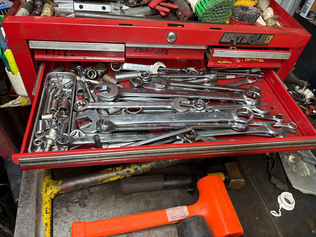 Used 64” x 40” x 41” metal shop table w/ contents