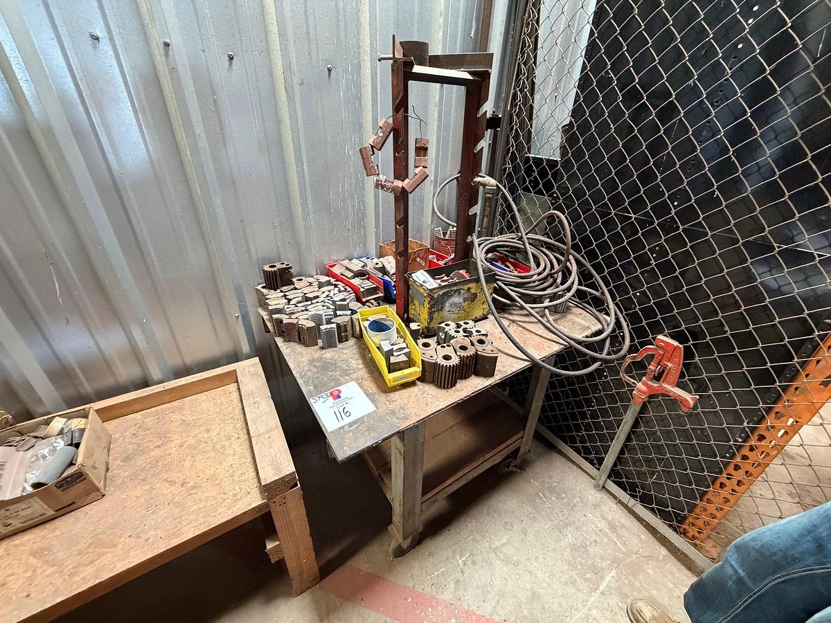 Used 44” x 32” x 34” metal shop table w/ assorted tubing tong jaws & assorted dies