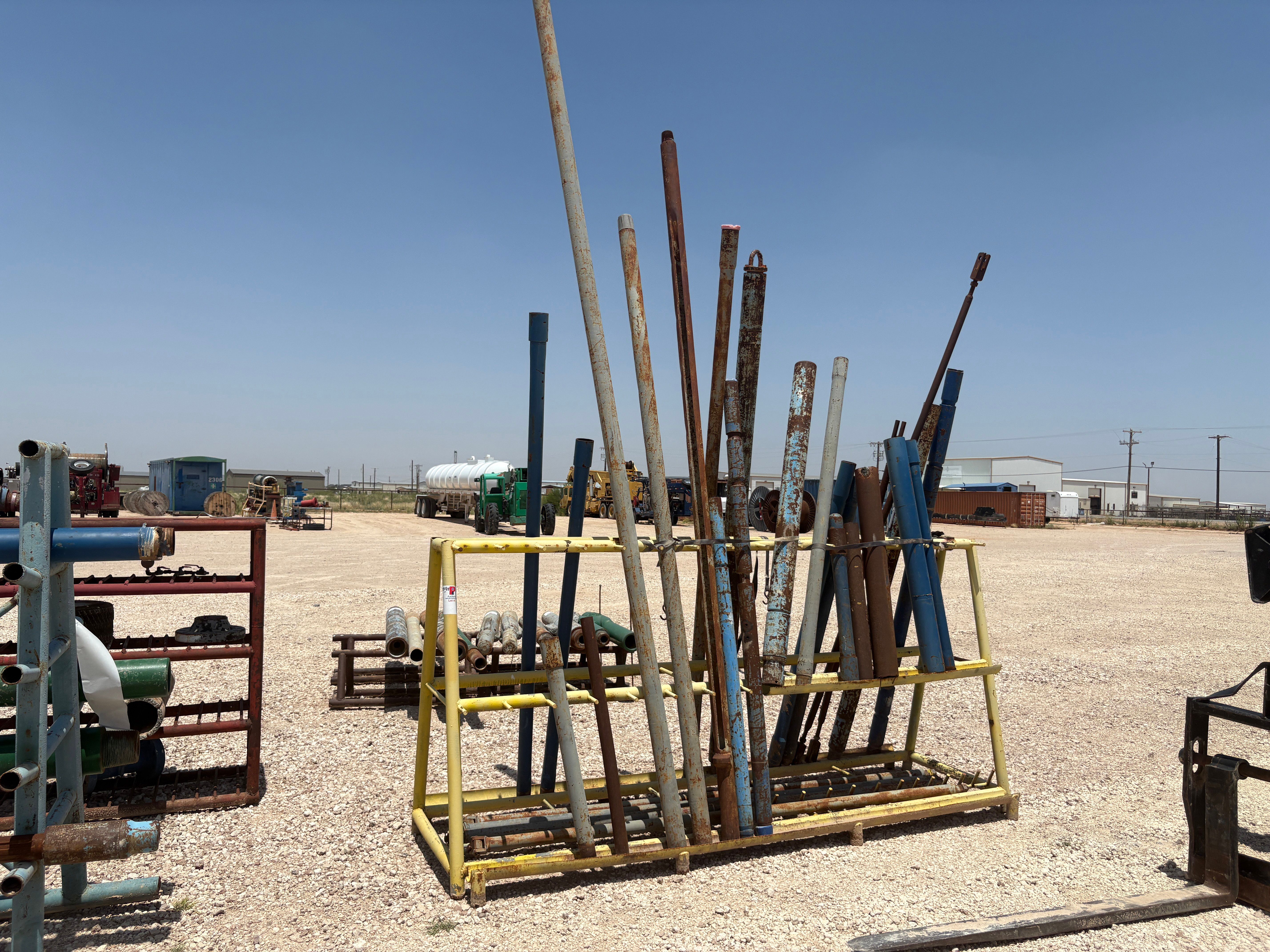 Used 10’ x 3.5’ x 5’ A-frame tool rack W/ assorted tubing pup jts, drain subs, stock pipe, etc.