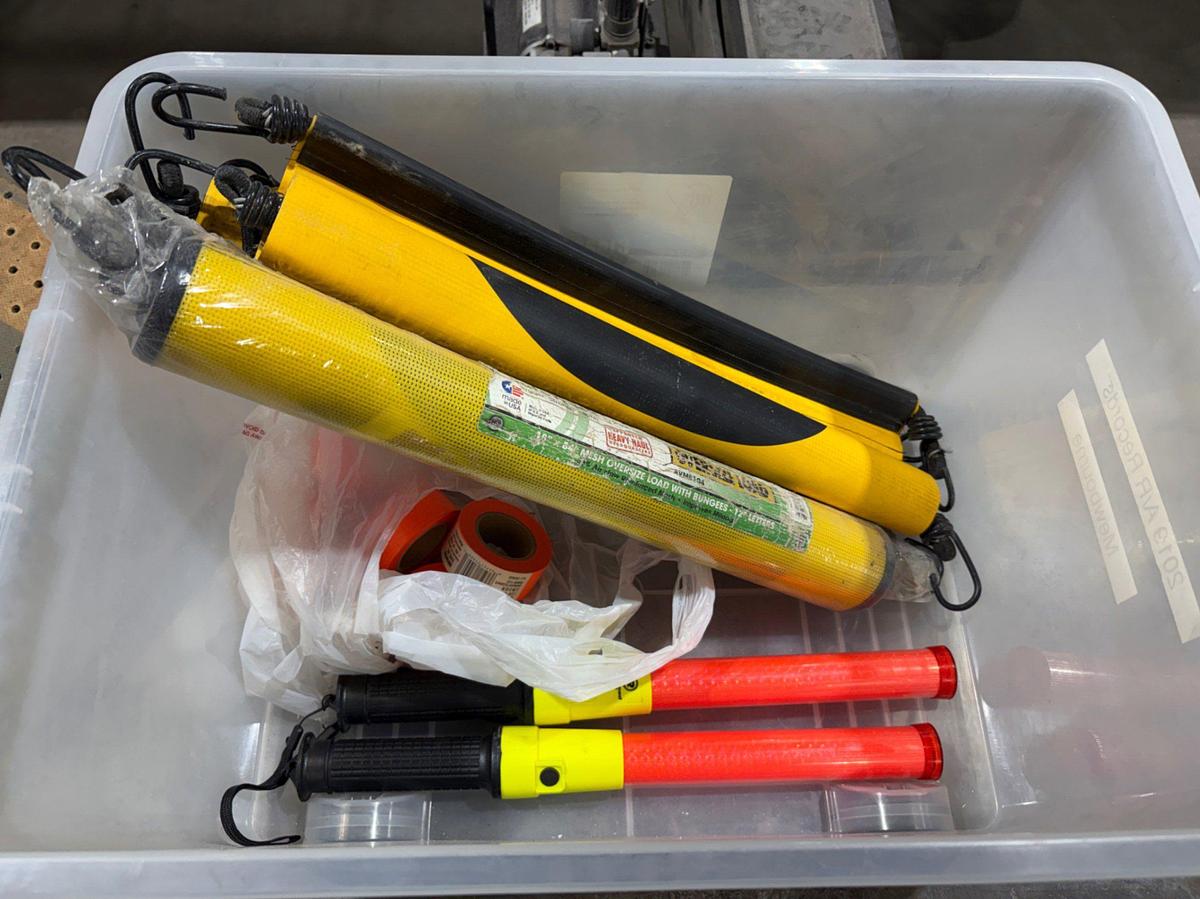 Used Box of “Oversized Load” banners, marshaling wands, flag tape