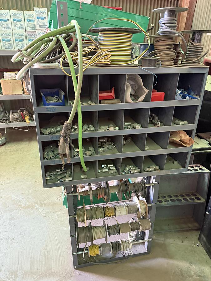 Used 96”L X 24”W X 72”H 3-SHELF RACK, (1) 24-COMP. FITTING BIN, & (1) 4-ROW ELECTRIC WIRE REEL RACK, ALL W/ TRUCK PART & RELATED