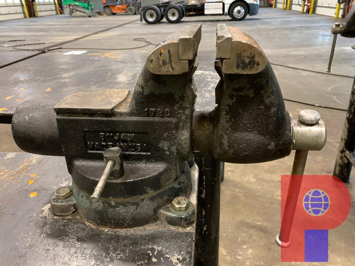 Used 8’ X 4’ STEEL TABLE W/ 8” JAW VICE