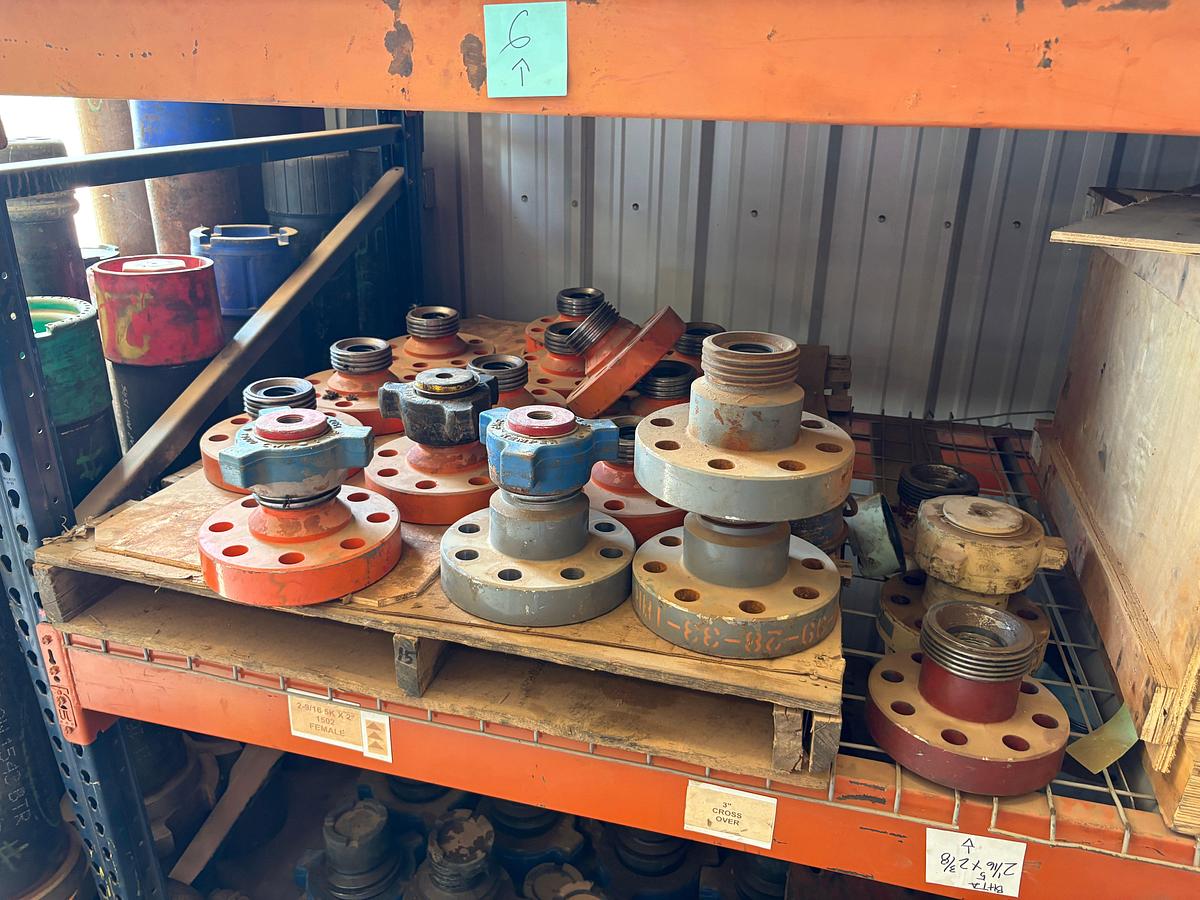 Used Contents of (4 shelves) w/ (65) assorted 2” to 4” weco flanges, casing hangers, & (38) 7” casing pup jts