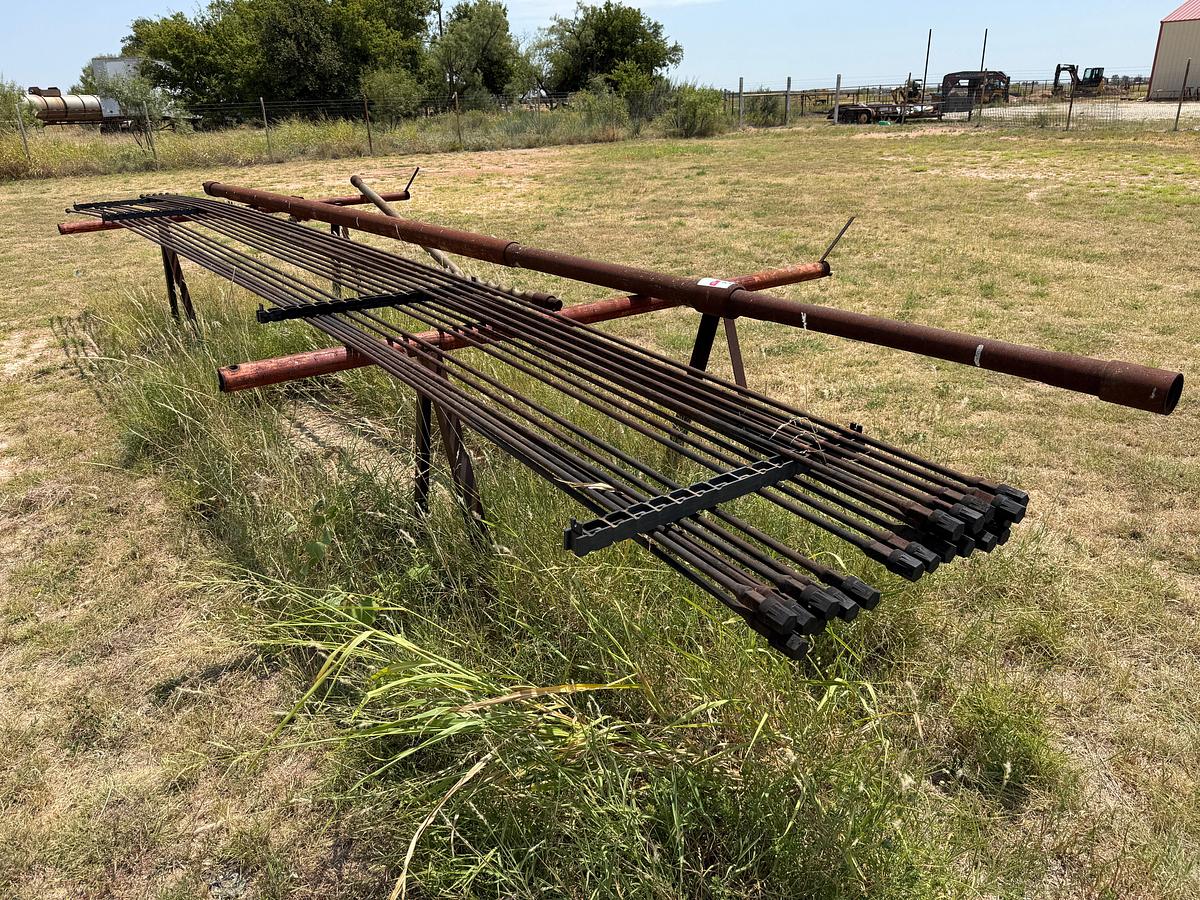 Used LOT W/ (19) UNUSED 5/8” x 25’ SUCKER RODS & (2) PIPE RACKS