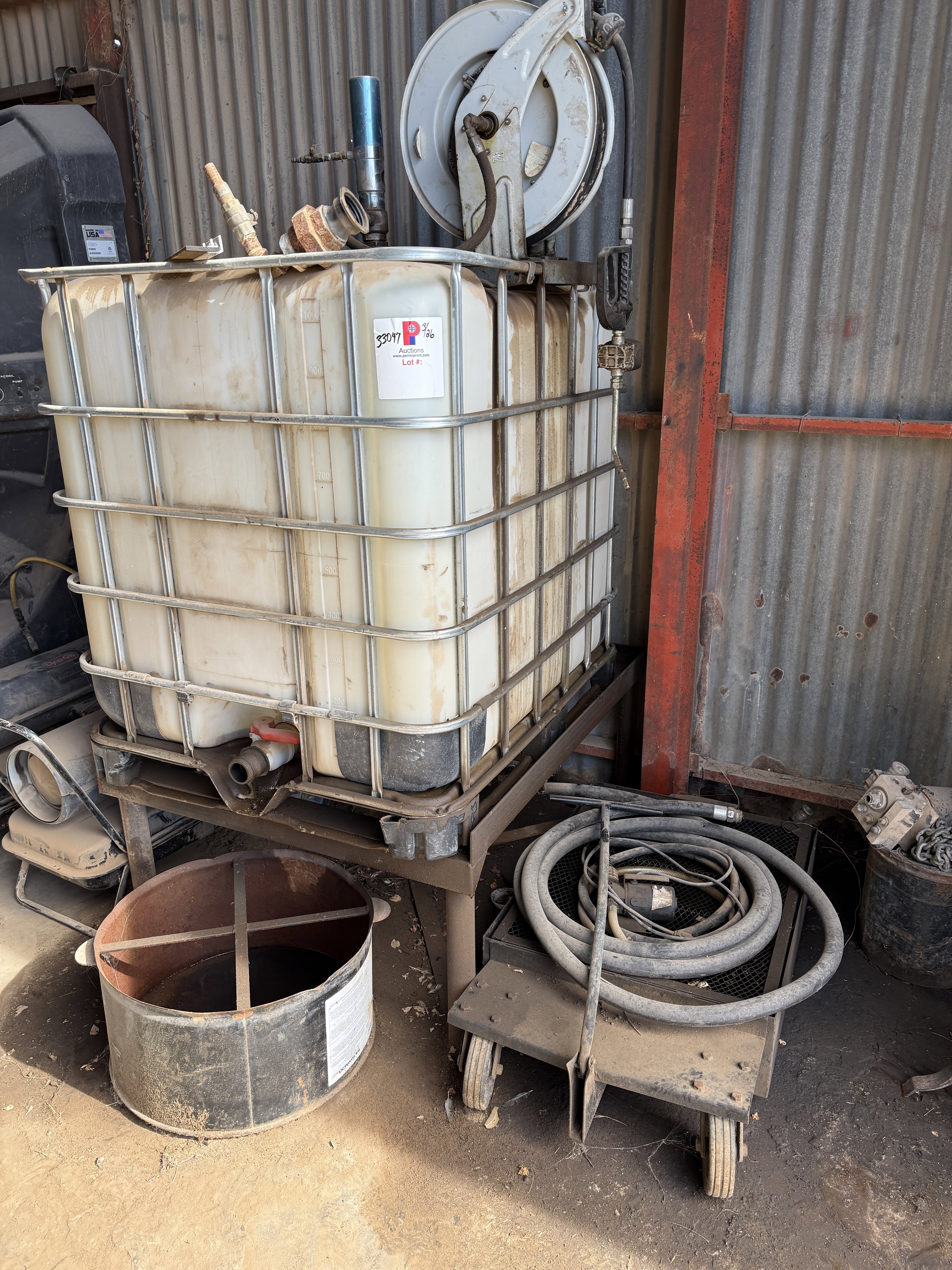 Used 44”L X 36”W X 40”H OIL TOTE W/ PNEUMATIC GUN HOSE REEL, & (2) OIL CATCH PANS