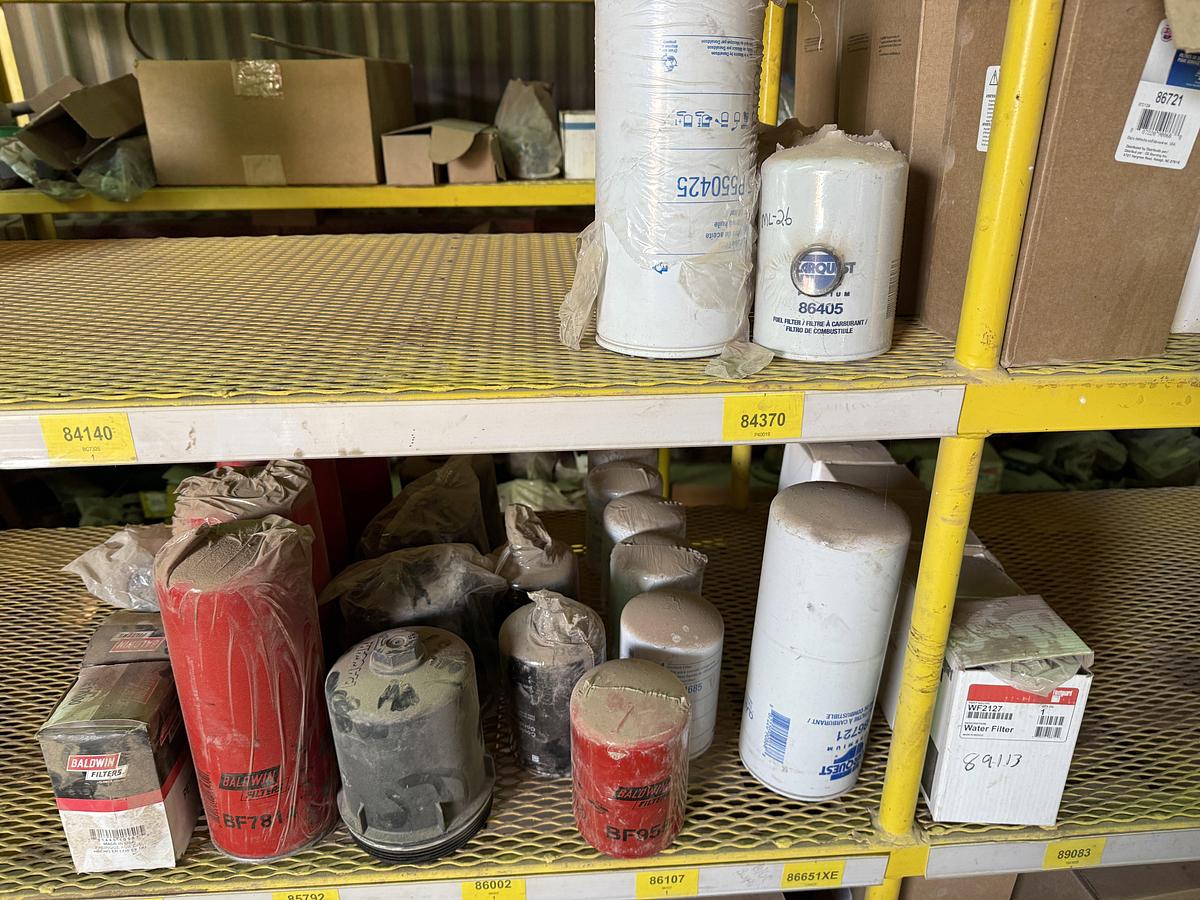 Used (2) 120”L X 24”W X 72”H 5-TIER METAL RACKS W/ TRUCK & ENGINE PARTS CONTENTS