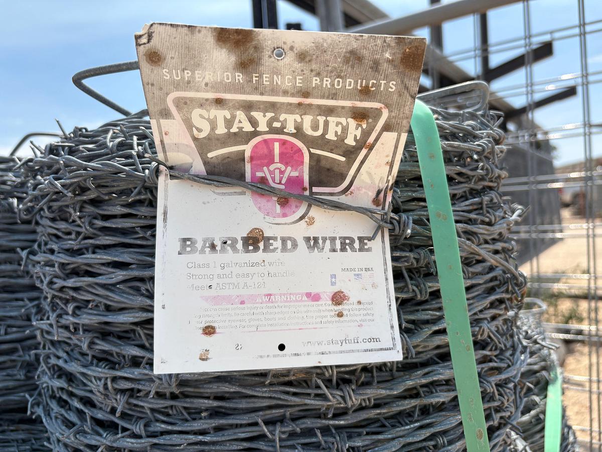 Used (21) unused rolls of stay-tuff barbed wire