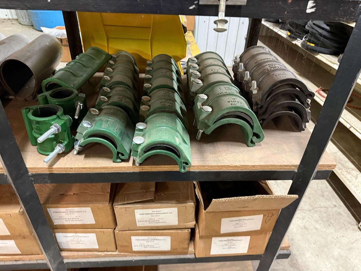 Used 5-SHELF RACK W/ CONTENTS OF PVC BALL VALVES & UNIONS, NETCO COLLAR LEAK REPAIR CLAMPS, (14+) BOXES 5/8” THRU 1” STUDS & NUTS
