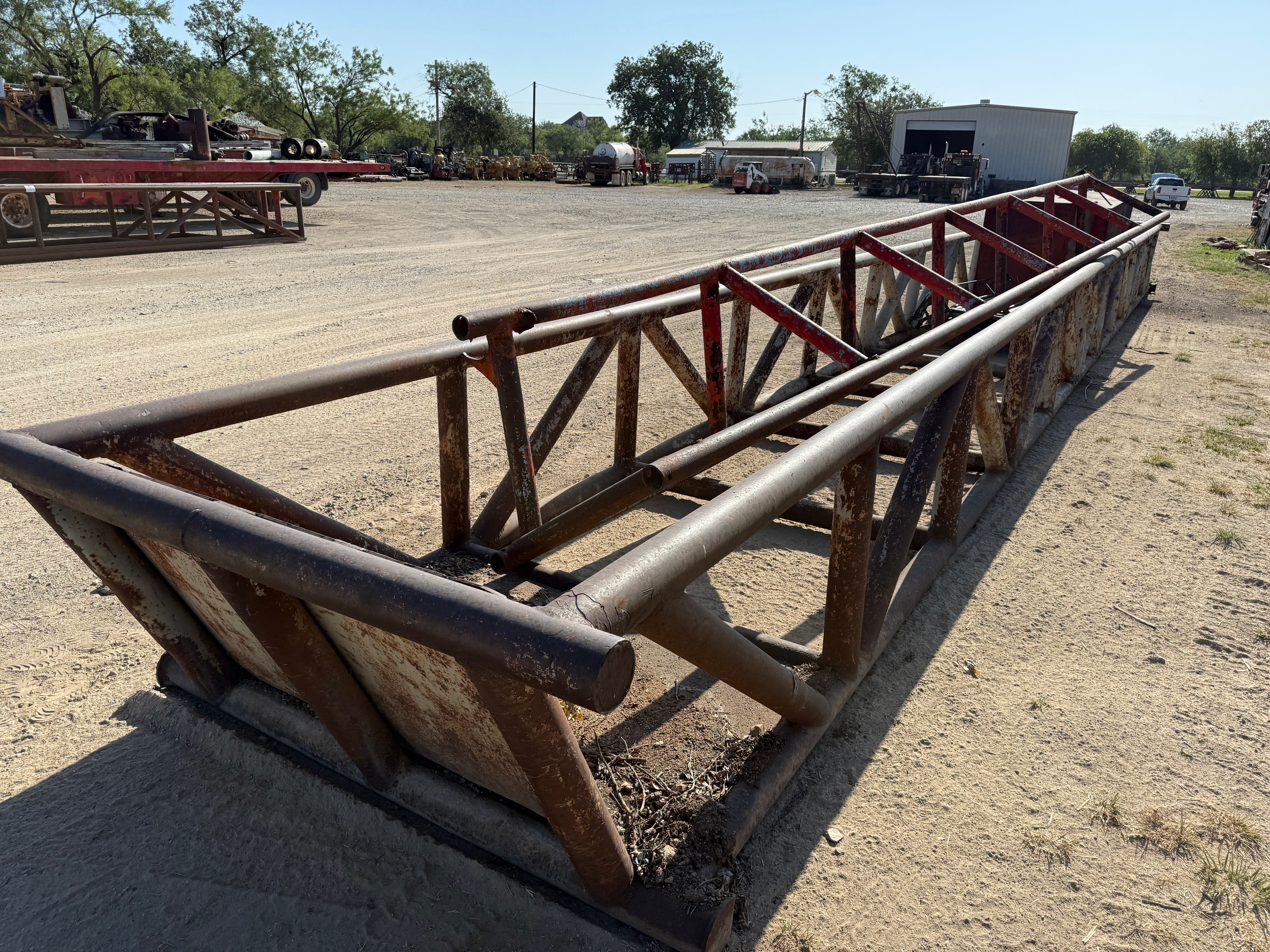 Used 50’ x 5’ x 3’ SKIDDED PIPE TUB W/ CONTENTS